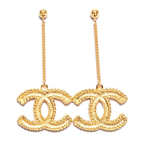 chanel long gold earrings.